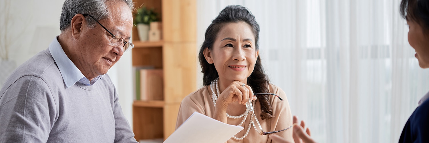 couple discussing wills and estates with lawyer