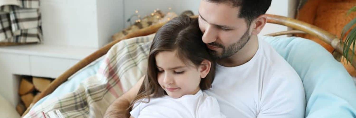 father reading to daughter