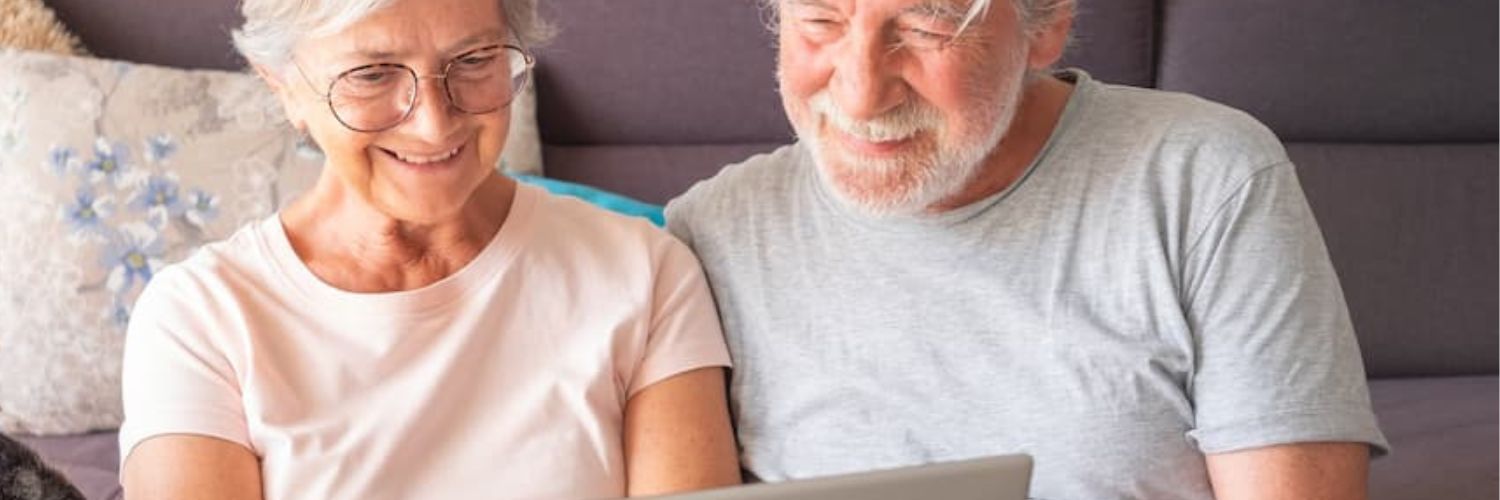 older couple looking at a laptop